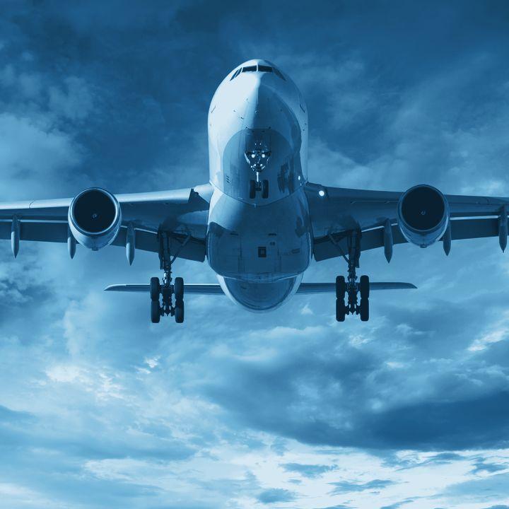 Aircraft on approach at dusk
